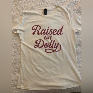Cute Dolly Parton tshirt! White with purple metallic lettering.